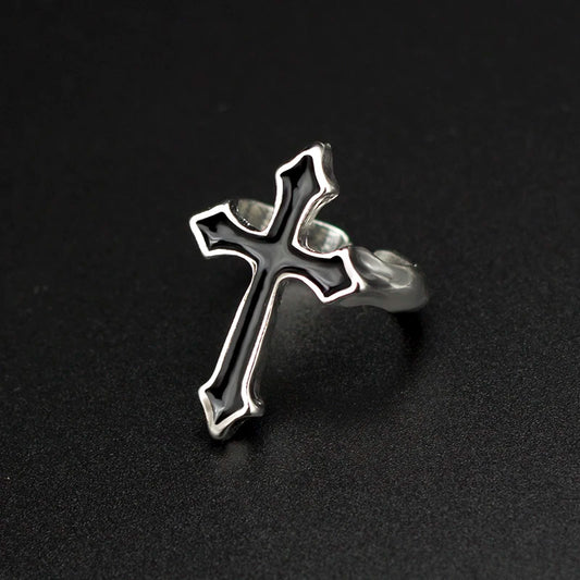 Metal ring with black cross